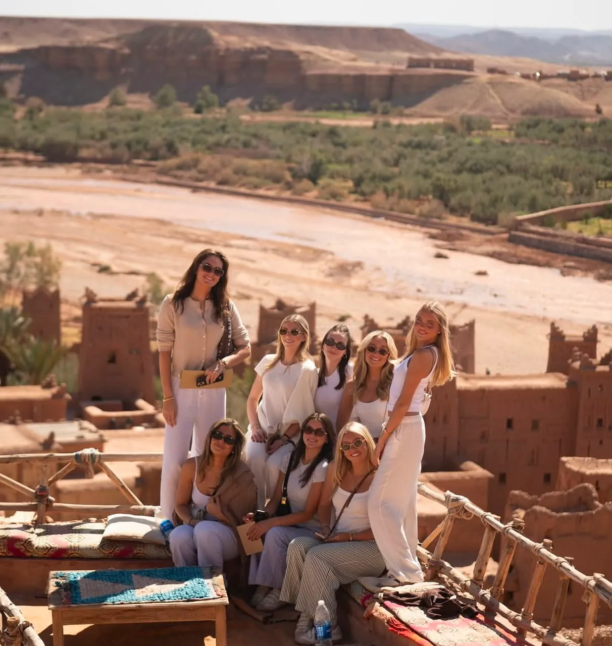 Traditional Moroccan medina street with carved doors on a 9-day imperial cities and Sahara tour