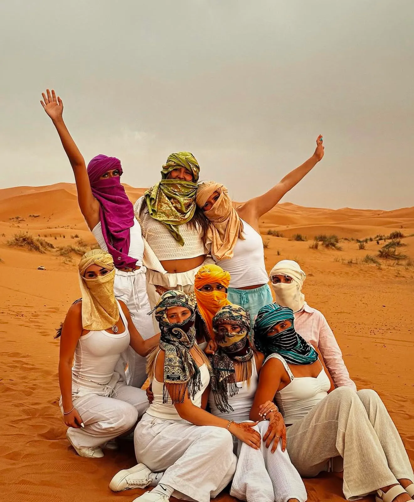 Family walking on the dunes of Erg Chebbi during a Morocco Sahara family tour